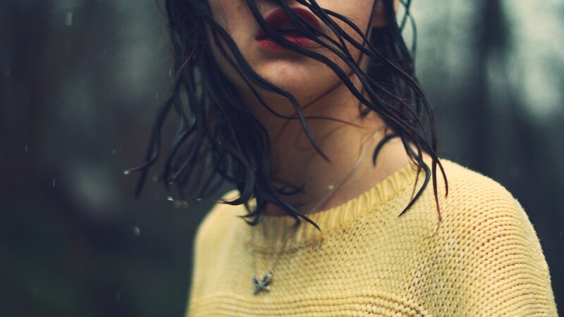 woman with wet hair in rain