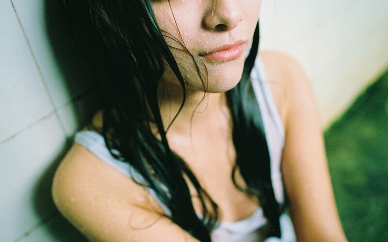 woman with wet hair in shower