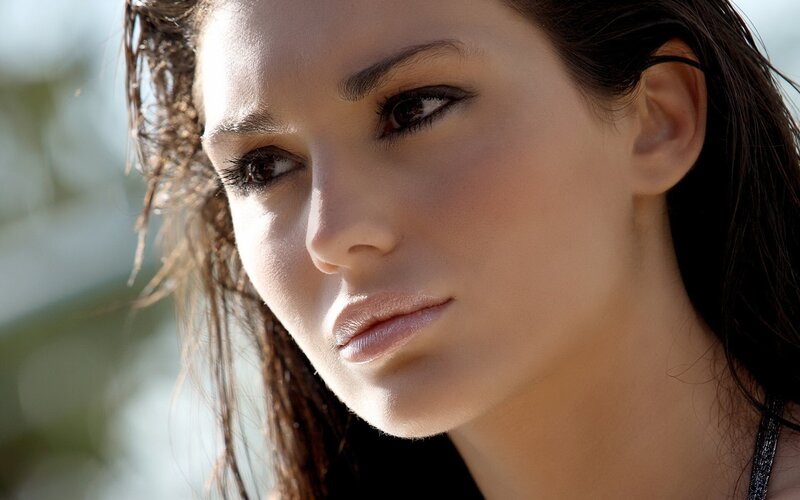 woman with wet hair in sunlight