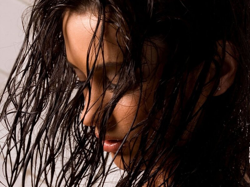 woman with wet hair looking down