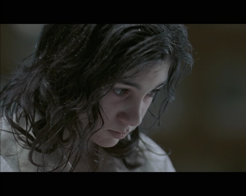 woman with wet hair looking down