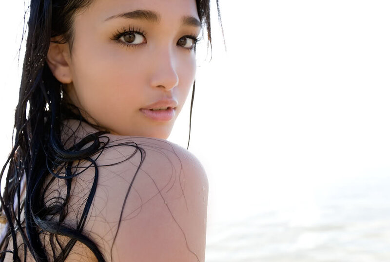 woman with wet hair on beach