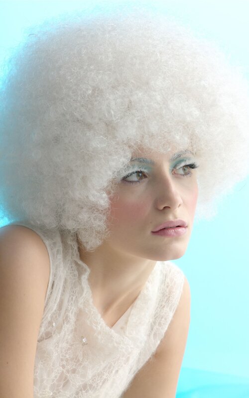 woman with white afro wig