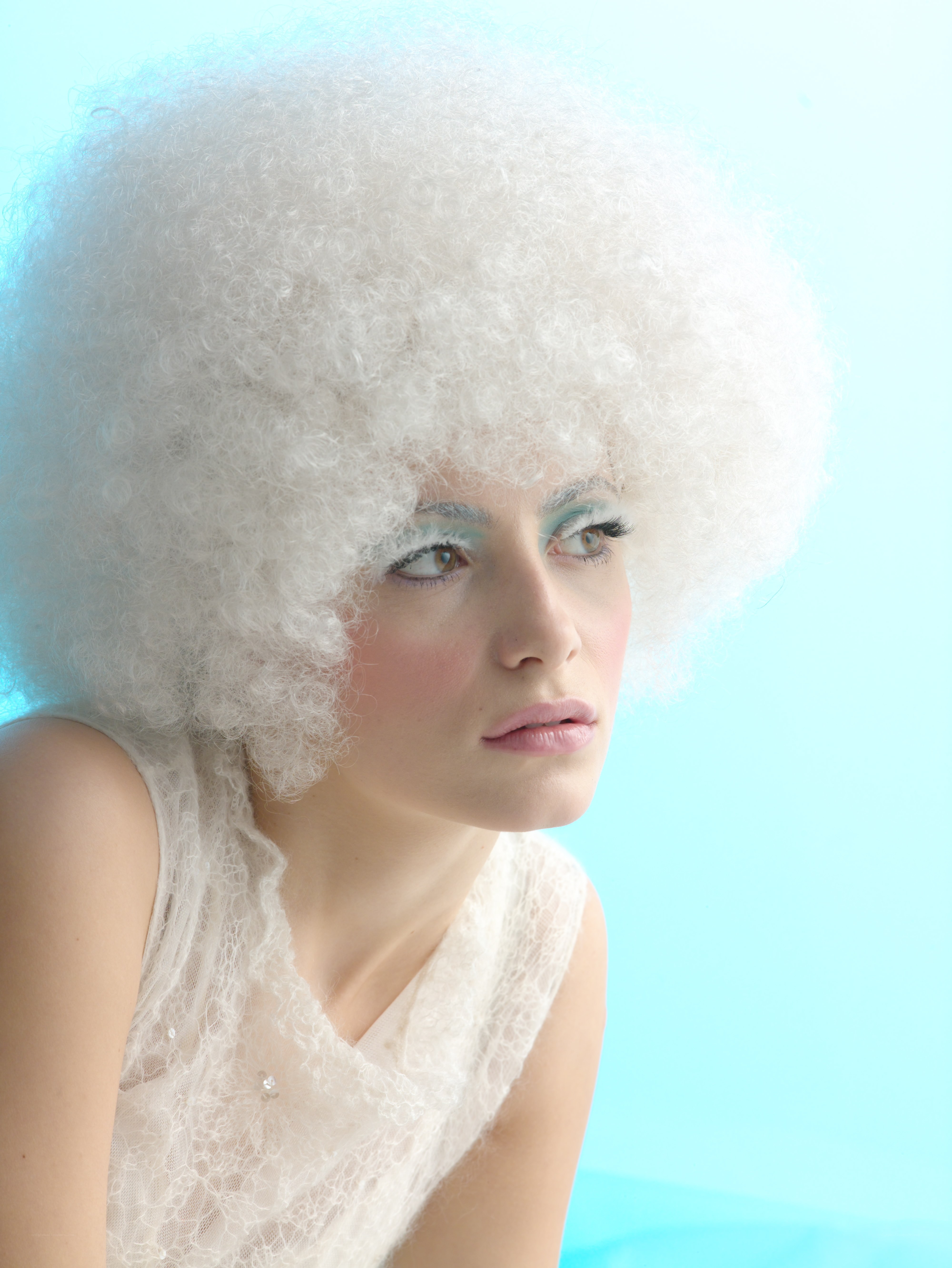 woman with white afro wig