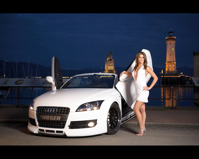 Woman with white Audi at harbor