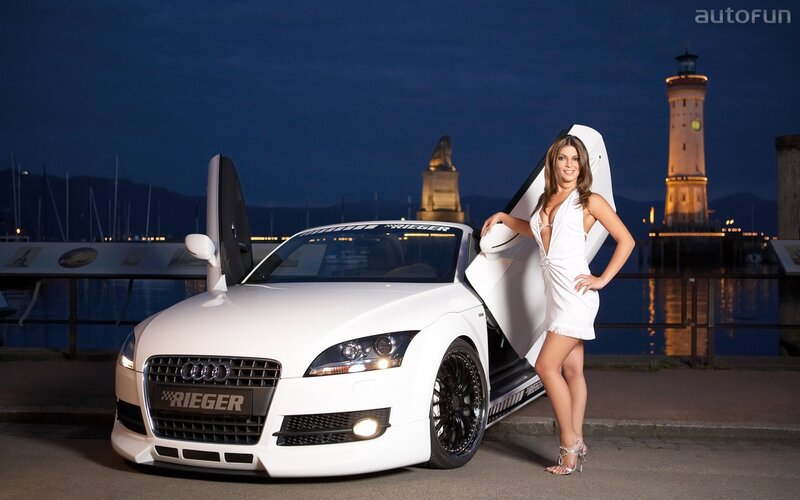 Woman with white Audi at night