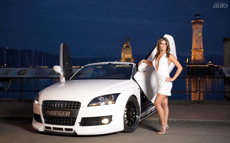 Woman with white Audi at night
