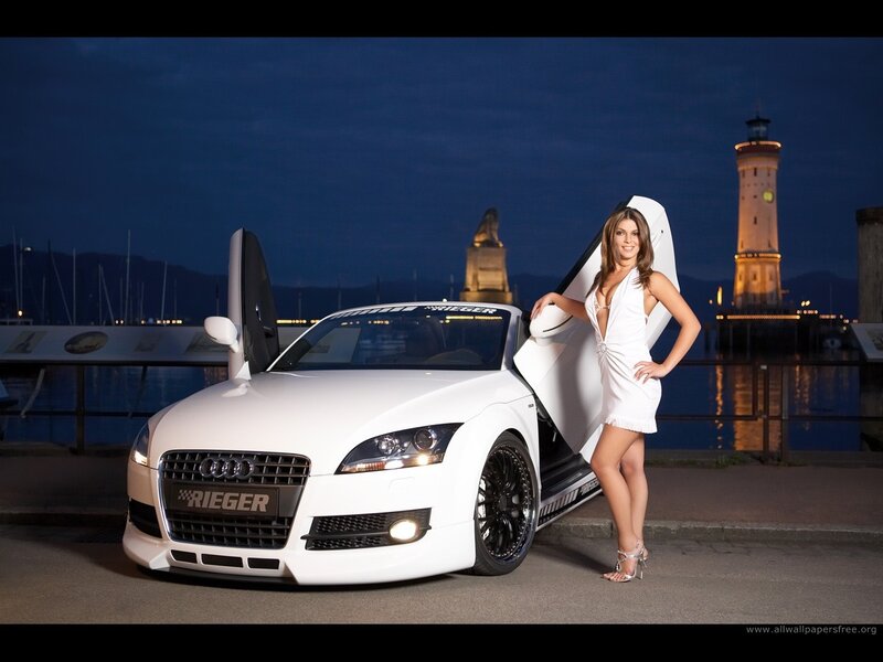 Woman with white Audi at night