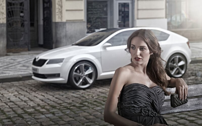 woman with white car on cobblestone
