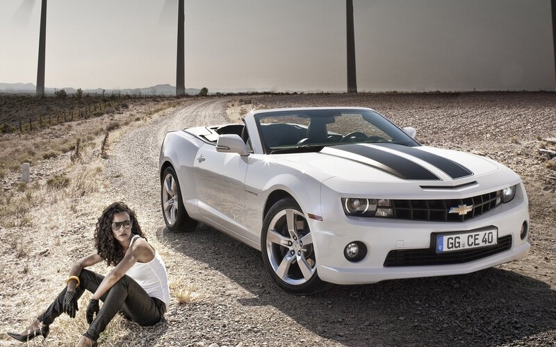 Woman with white convertible car