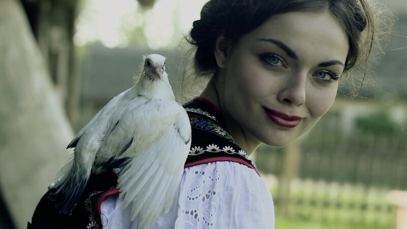woman with white dove on shoulder