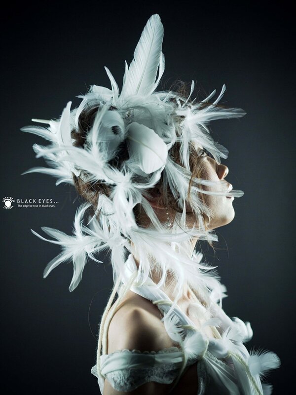 woman with white feather headdress