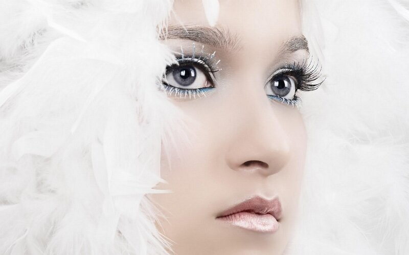 woman with white feathers