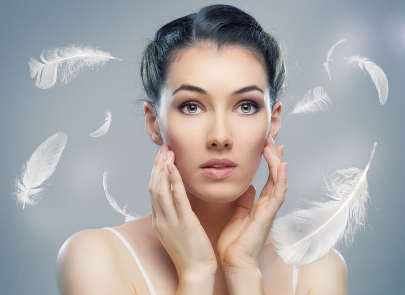 Woman with White Feathers — Serene