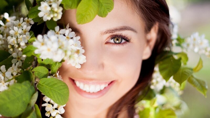 Woman with White Flowers — Serene, Spring, Photograph, White Flowers, Green Leaves
