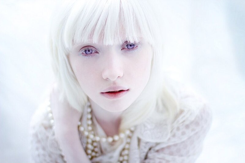 woman with white hair and purple eyes