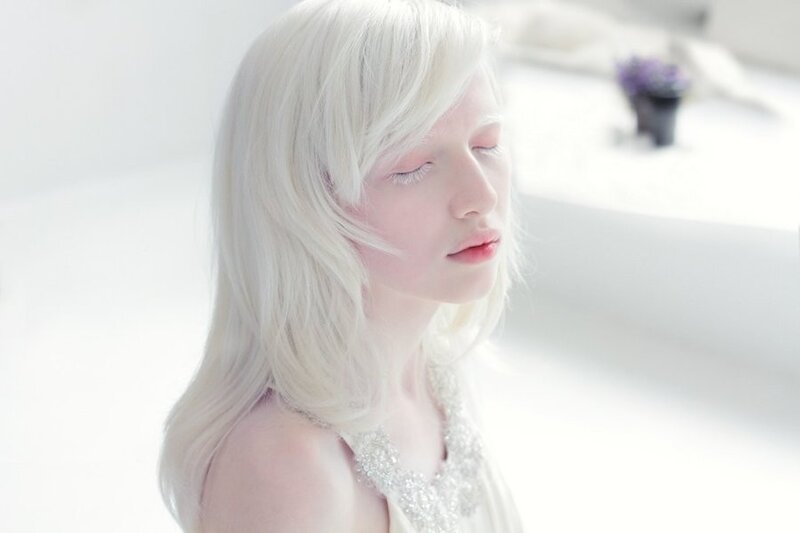 woman with white hair in soft light