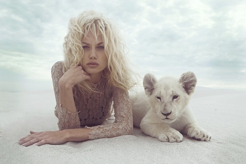 Woman with white lion cub