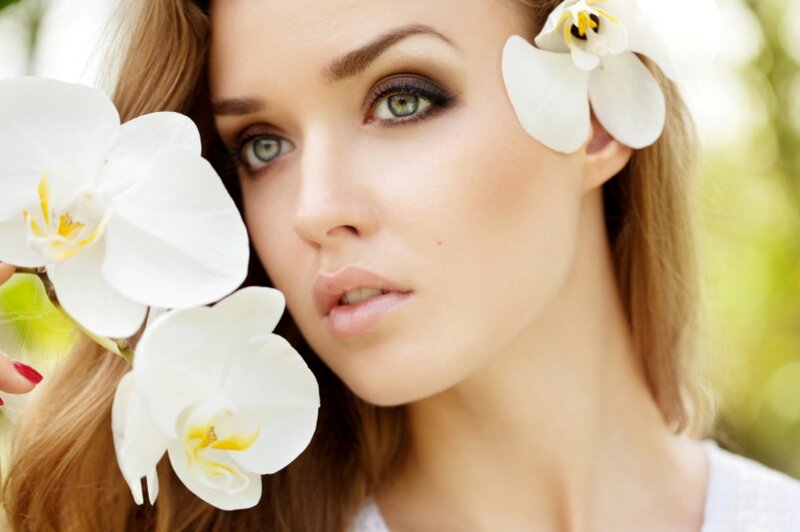 Woman with White Orchids — Serene