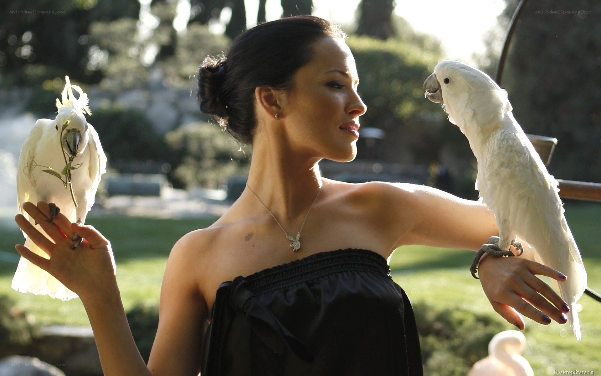 woman with white parrots