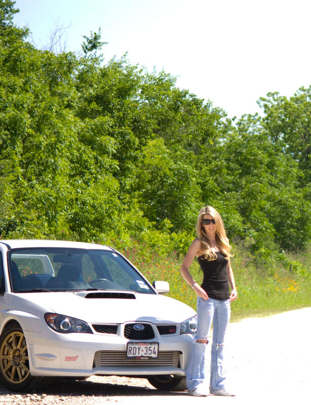 Woman with white Subaru car