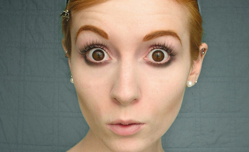 woman with wide eyes and makeup