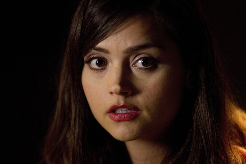 woman with wide eyes in dark