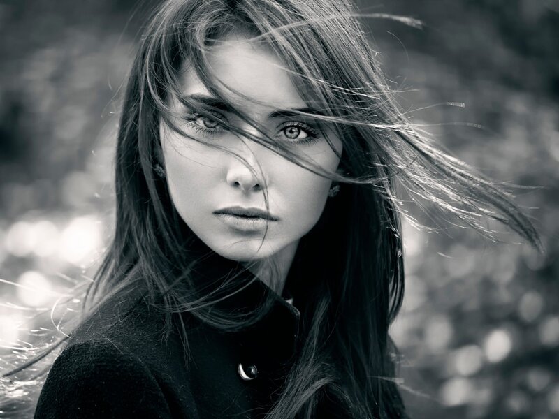 Woman with Wind-blown Hair — Black, Dramatic, Photograph, Coat, Eyes