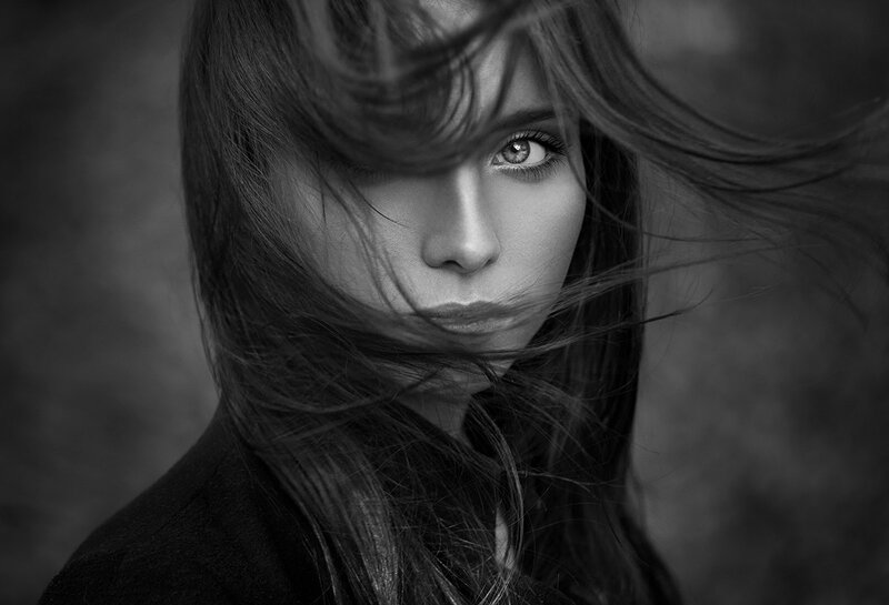 Woman with Wind-blown Hair — Black, Dramatic, Photograph, Eyes, Coat
