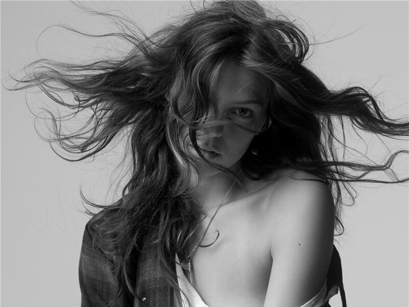 Woman with Wind-blown Hair — Black, Dramatic, Photograph, Necklace