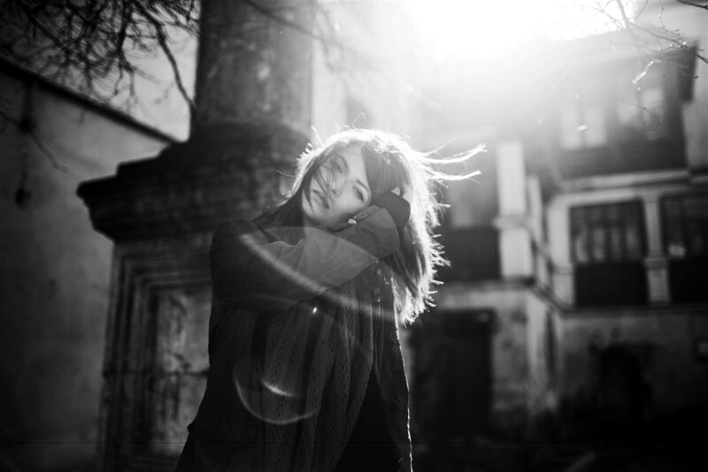Woman with Wind-blown Hair — Black, Dramatic, Sunset