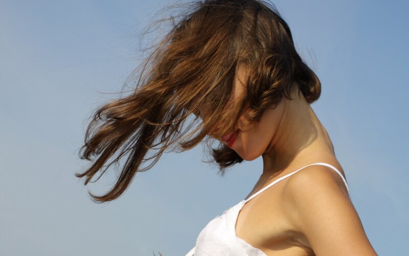 Woman with Wind-blown Hair — Blue, Serene, Afternoon