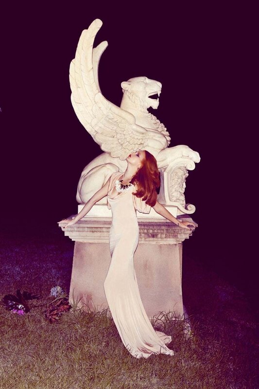woman with winged lion statue