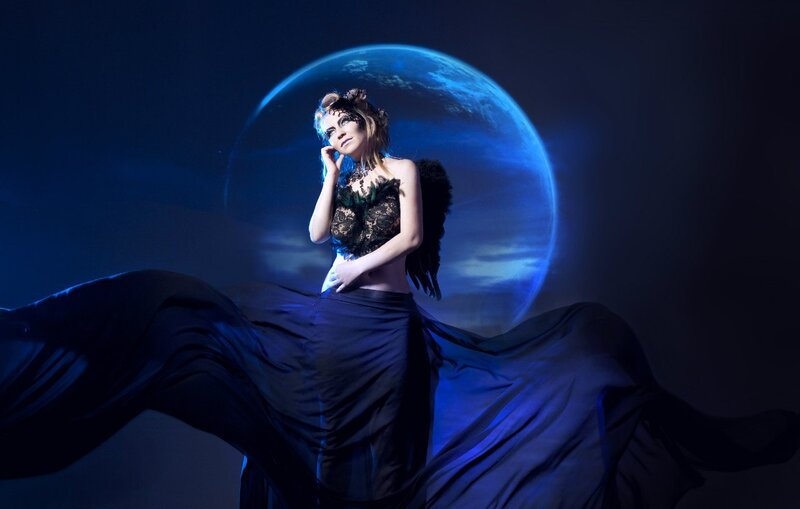 Woman with Wings and Mask — Blue