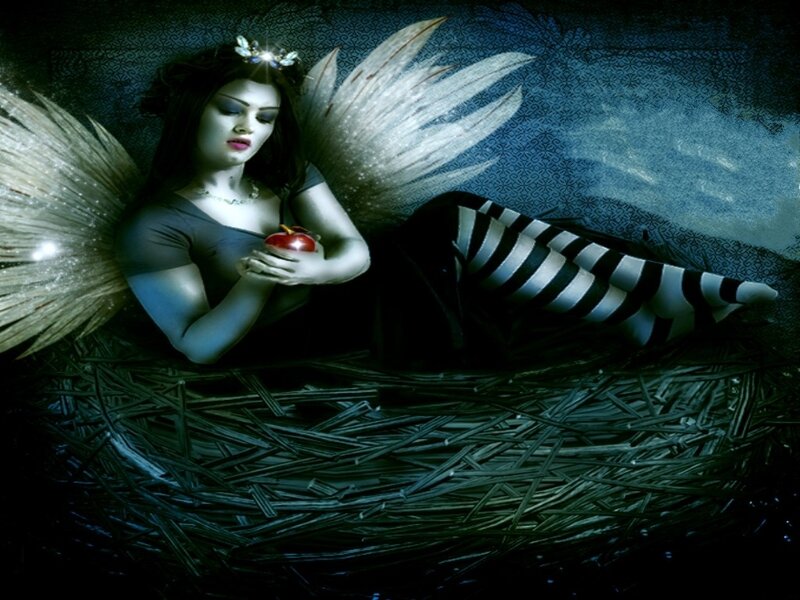 woman with wings holding apple