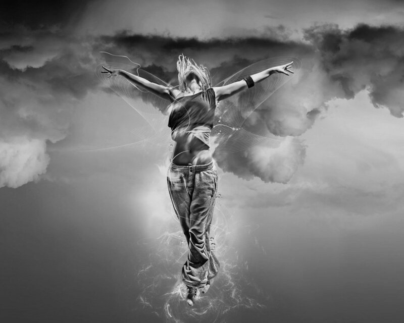 woman with wings in clouds