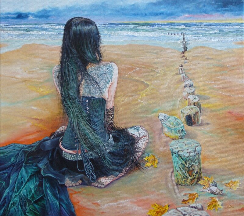 Woman with wings on beach