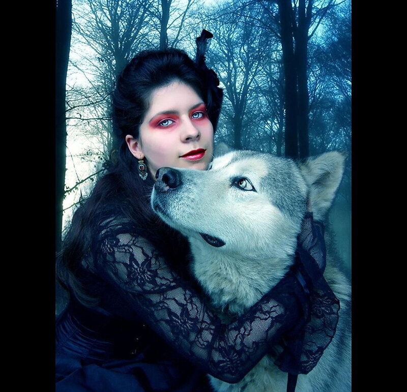 woman with wolf in forest