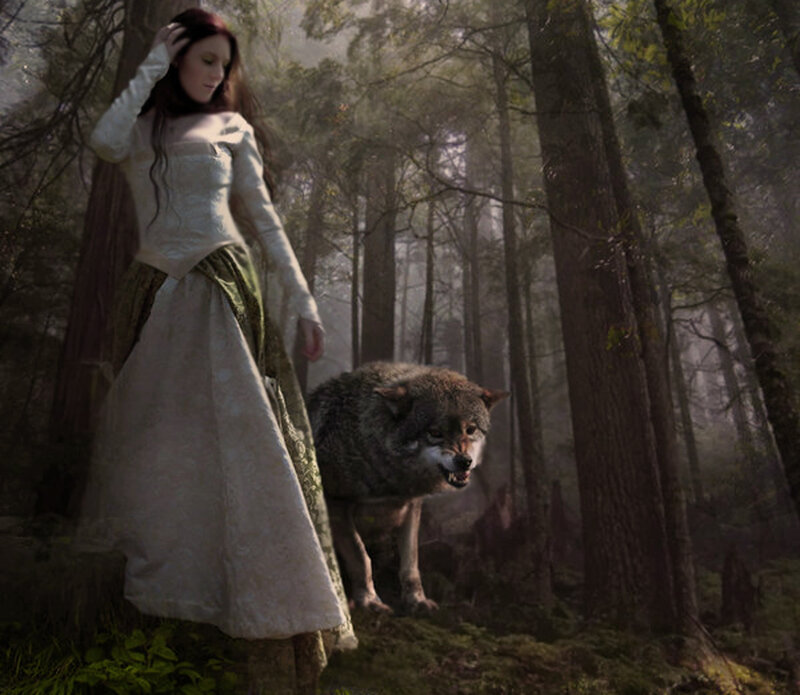 woman with wolf in forest