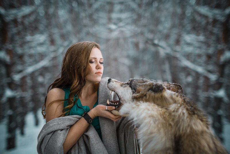 Woman with Wolf in Snow — Gray