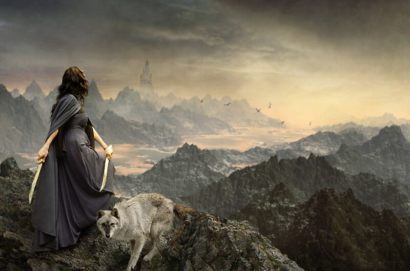 Woman with wolf on a mountain