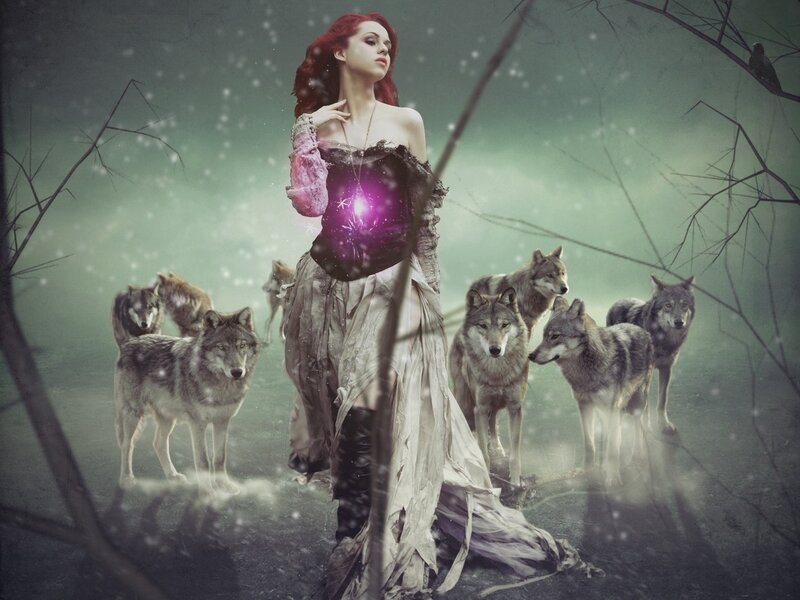 woman with wolves in forest