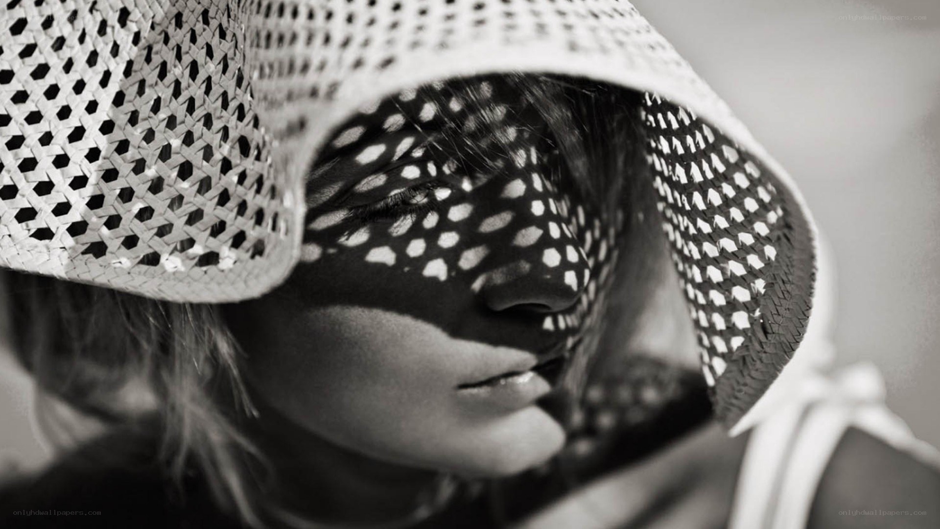 woman with woven hat shadow