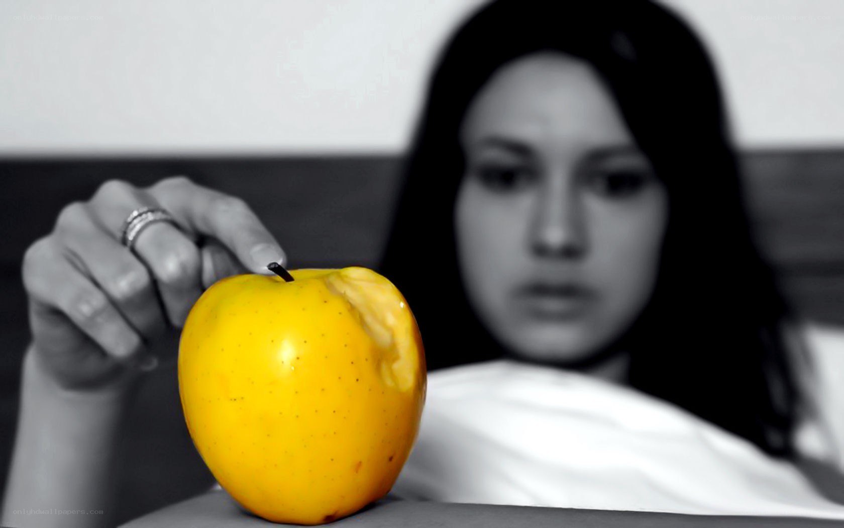 woman with yellow apple