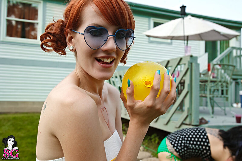 Woman with yellow balloon outdoors