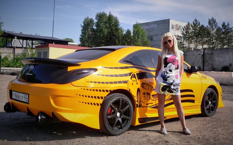 Woman with yellow car