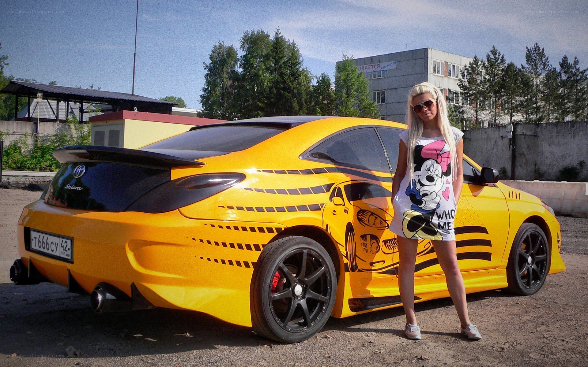 Woman with yellow car