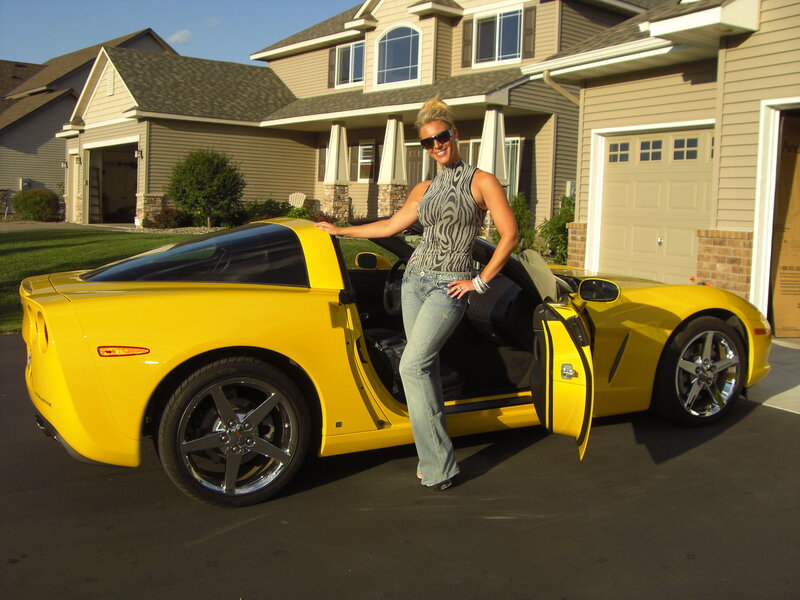 Woman with Yellow Car — Confident