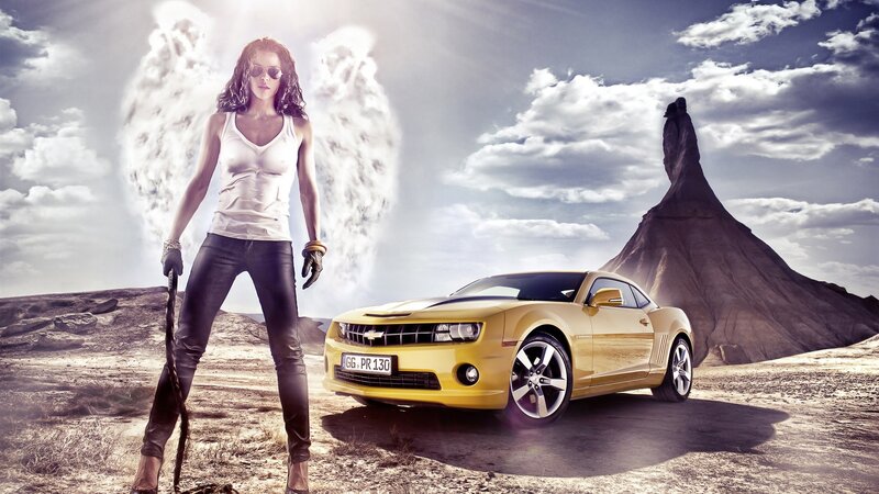 Woman with yellow car in desert