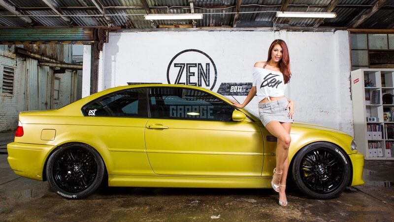 Woman with yellow car in garage